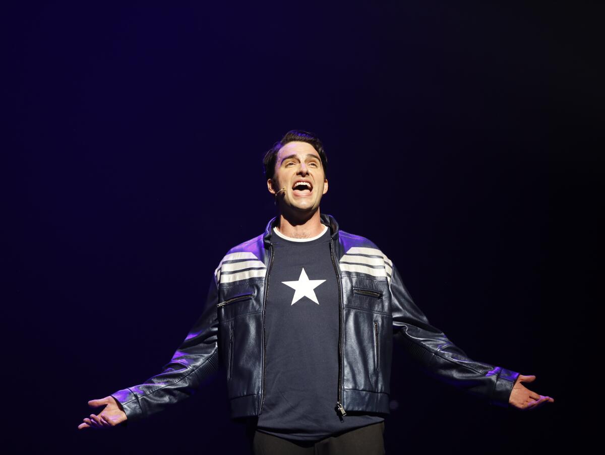 Steve Rogers (Captain America) sings onstage in Disney California Adventure's "Rogers: The Musical."