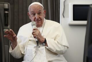 Pope Francis holds a news conference aboard the papal plane on his flight back after his 12-day journey across Southeast Asia and Oceania, Friday, Sept. 13, 2024. (Guglielmo Mangiapane/Pool Photo via AP)