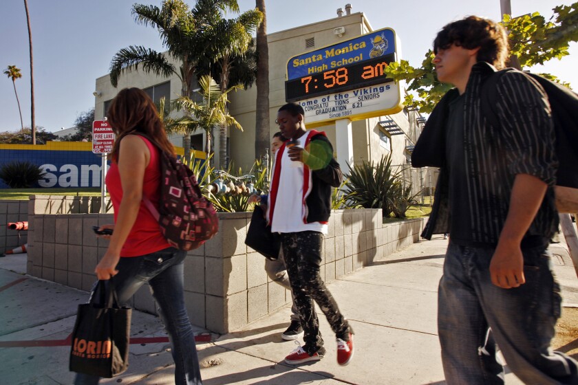 Students arrive for a summer school session at Santa Monica High School 