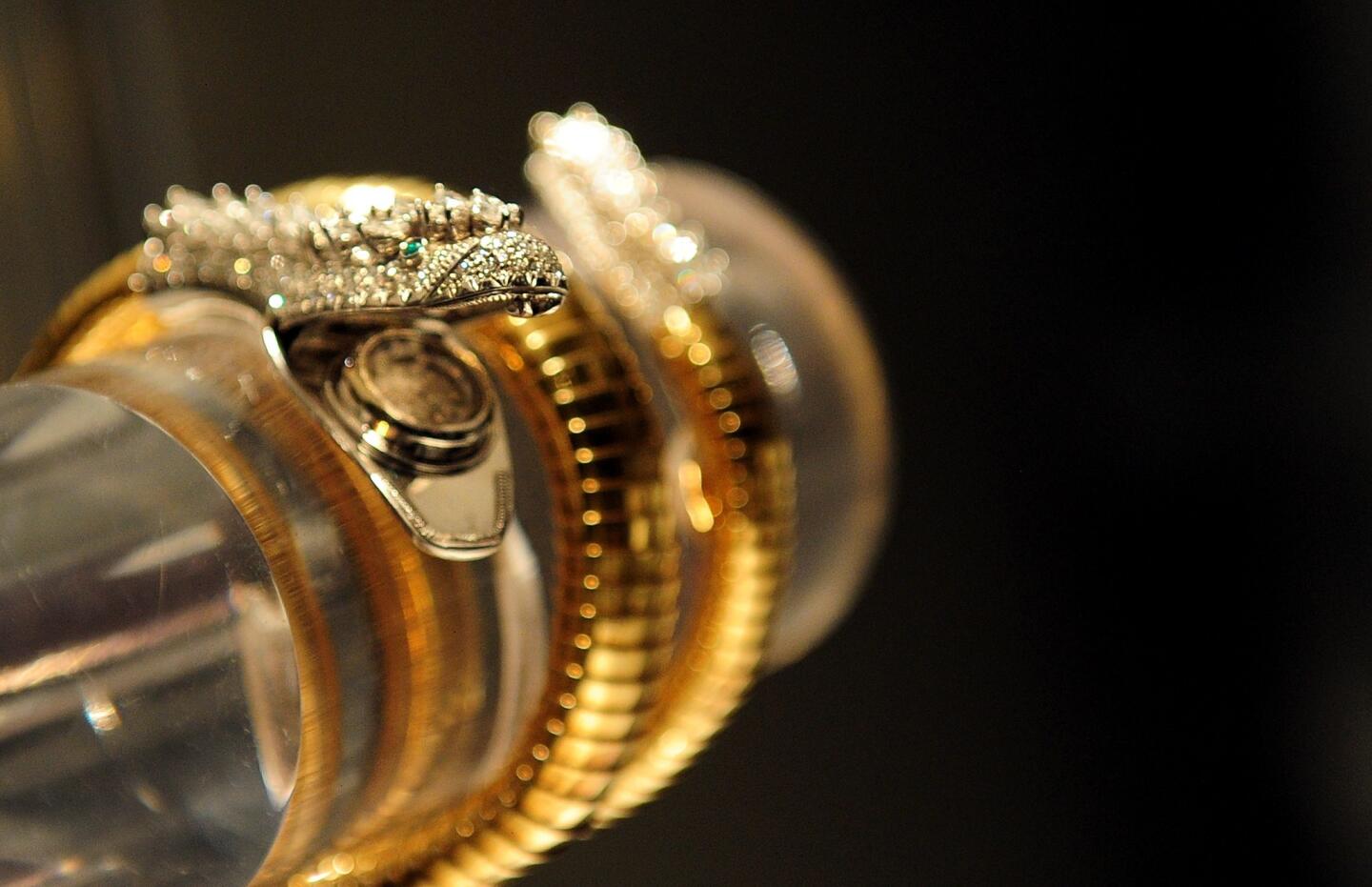 Diamond and emerald 'snake' bracelet-watch