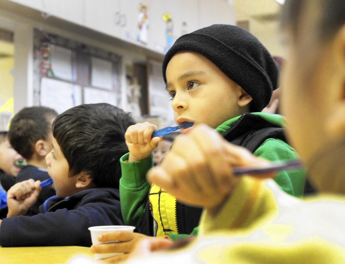 Derick Arciniega, 4, brushes his teeth at PACE Early Childhood Education program in Los Angeles. Gov. Jerry Brown and state legislators are negotiating more budget funds for preschools.