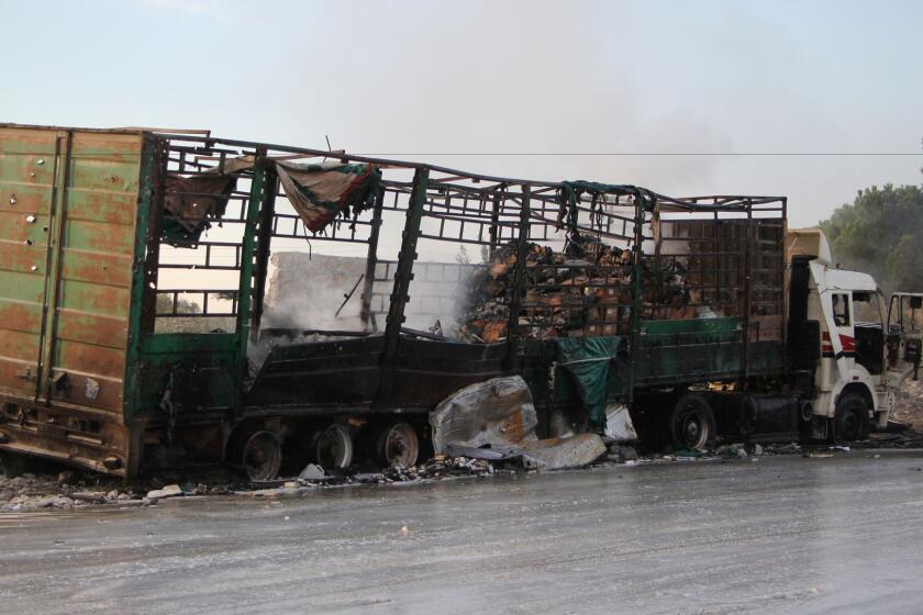 A truck that had been carrying aid supplies sits, destroyed, on the western outskirts of Aleppo, Syria, on Tuesday.