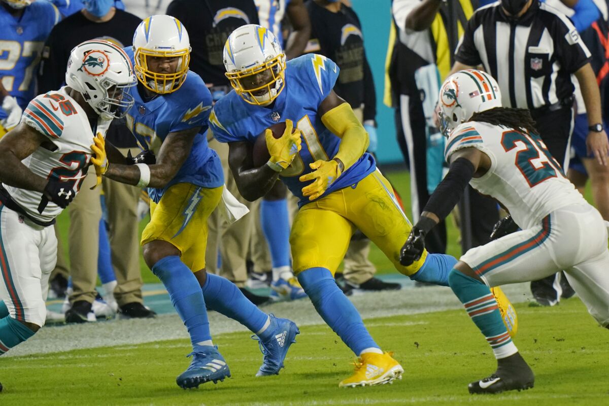 The Chargers' Kalen Ballage finds running room against the Miami Dolphins' defense.