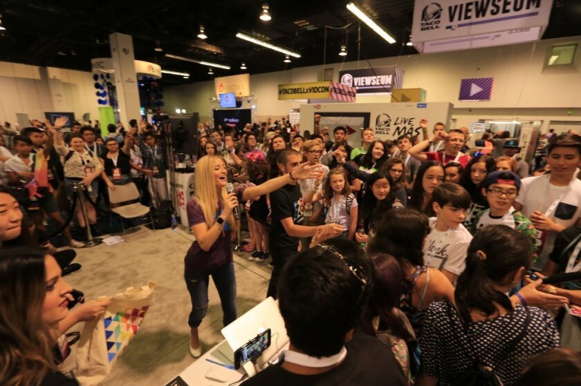 Crowds gather as YouTube star Justine Ezarik gives away Canon swag at VidCon last year.