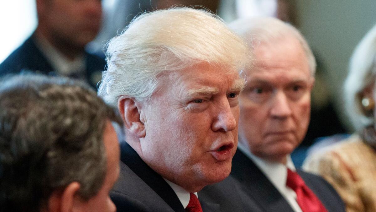 President Donald Trump in the Cabinet Room of the White House in Washington with Attorney General Jeff Sessions on March 29.