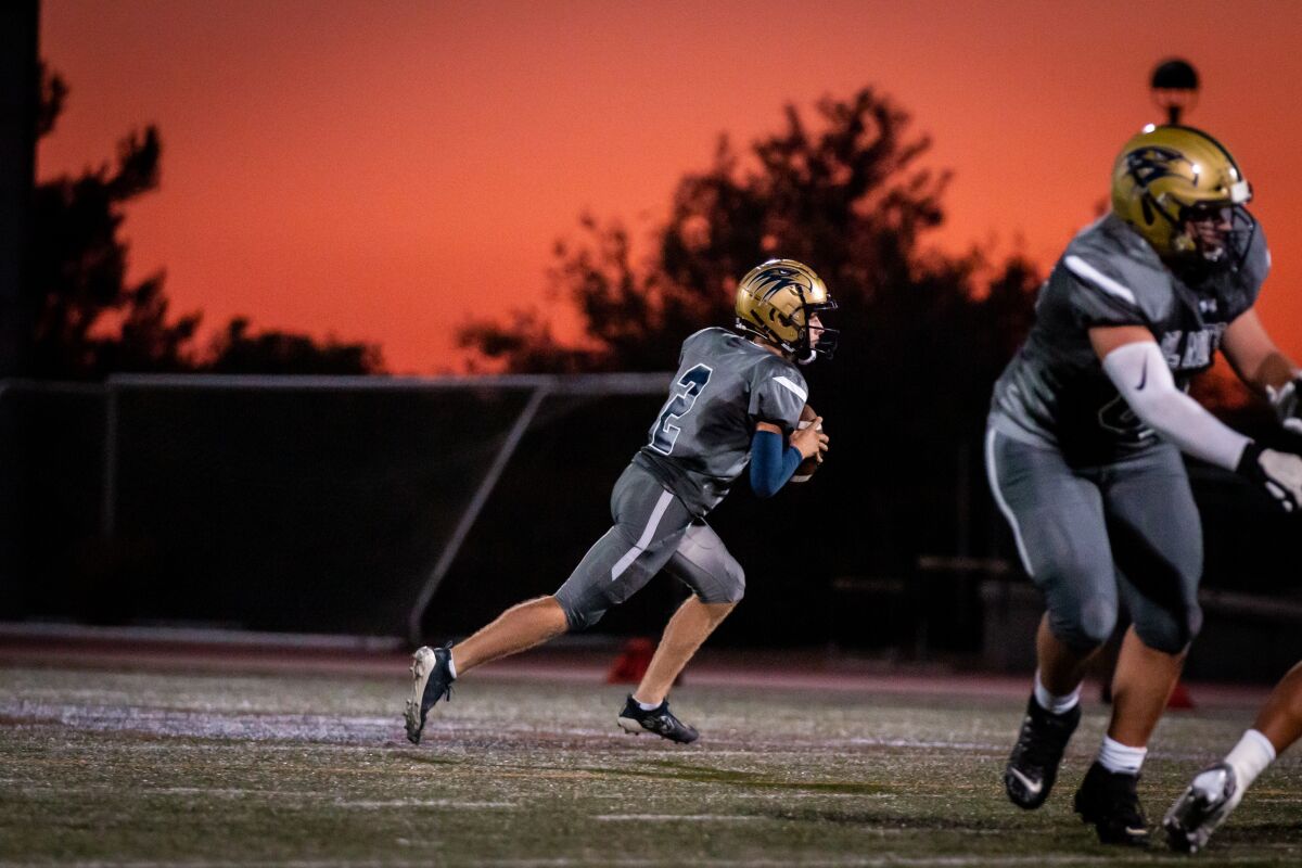 Jack Schneider, a junior at Del Norte High, opened his season at quarterback with a 42-0 victory over Escondido.