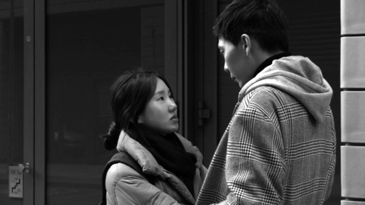A young woman looks up at a young man in the movie "Introduction."