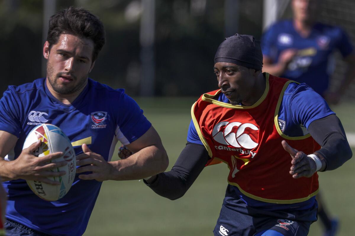 Perry Baker, right, pursues a teammate during a U.S. rugby sevens practice on Feb. 26, 2020, at Dignity Health Sports Park in Carson.