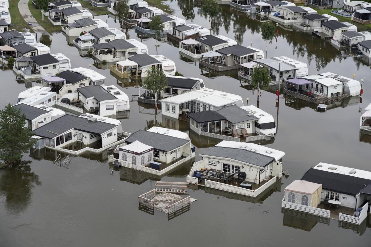 Homes in a neighborhood inundated by floodwaters