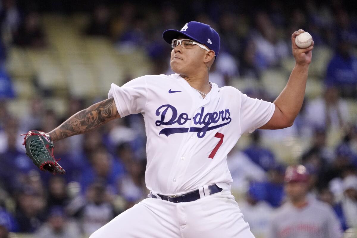 Dodgers starting pitcher Julio Urias throws to the plate during the first inning.