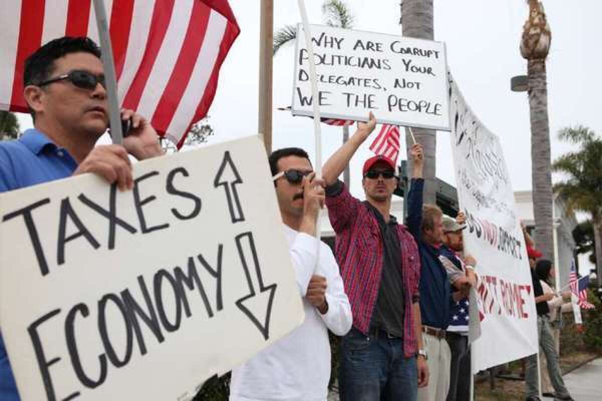 The IRS is under fire for giving extra scrutiny to applications for tax-exempt status from grass-roots conservative groups. Above, "tea party" demonstrators last June in Newport Beach.
