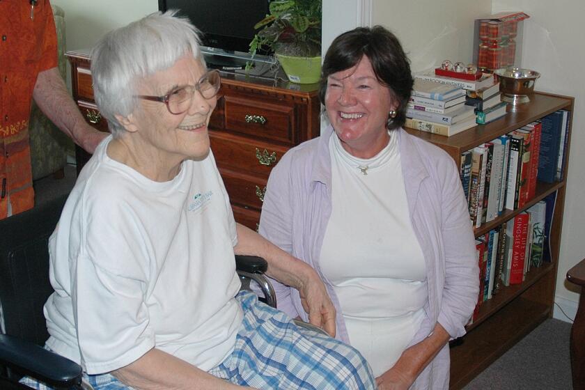 Harper Lee, left, seen in 2010 at her assisted living facility in Monroeville, Ala., with actress Mary Badham, who played Scout in the 1962 film adaptation of "To Kill a Mockingbird."