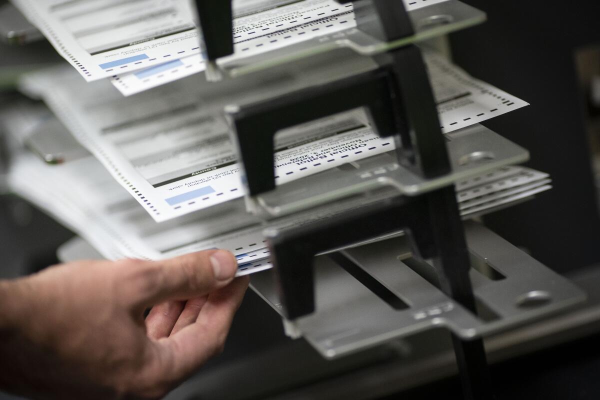 Poll workers sort early and absentee ballots