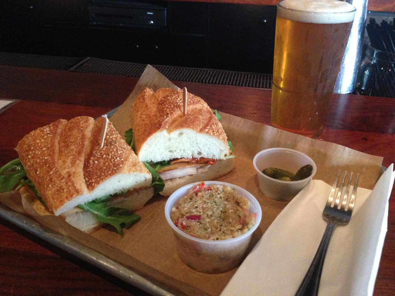 The turkey and smoked mozzarella sandwich ($9) with a happy hour beer ($4).