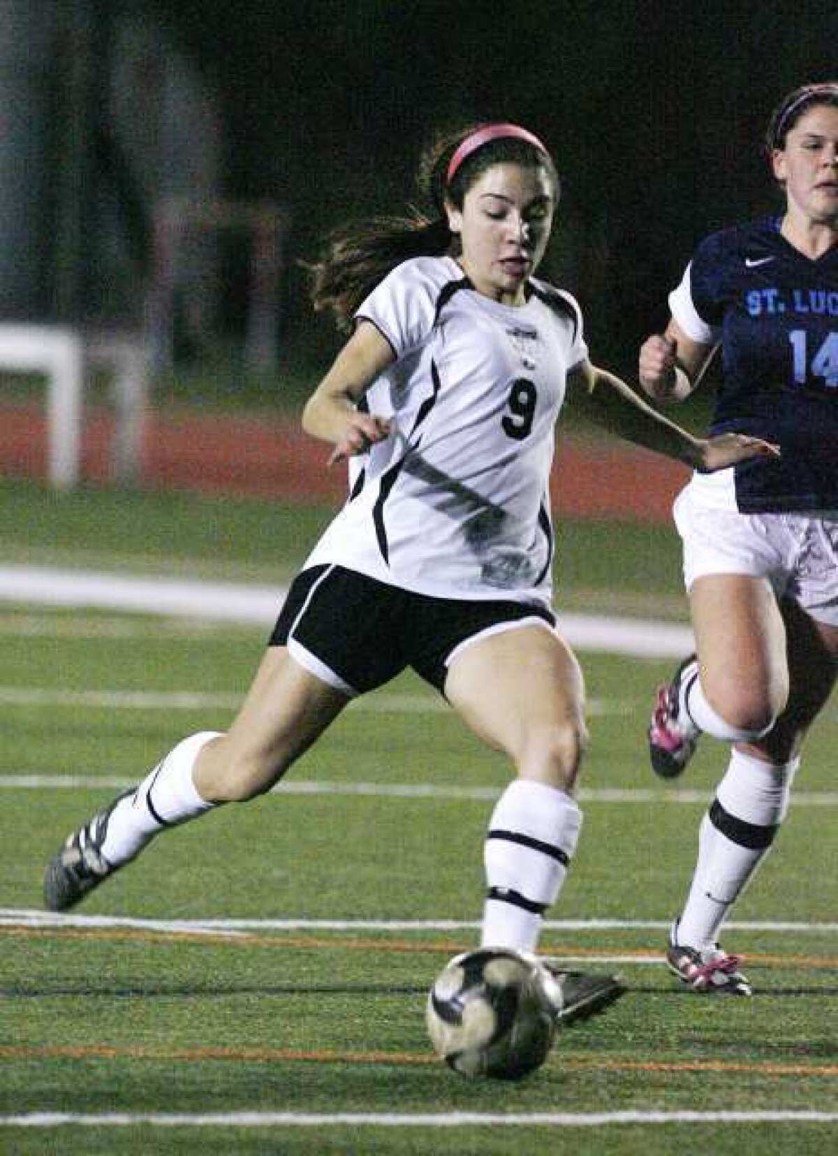 Sacred Heart's Laura Thompson shoots in the first half to score the first goal in the game against St. Lucy's in a non league girls' soccer match at Occidental College in Los Angeles on Friday, December 21, 2012. (Tim Berger/Staff Photographer)