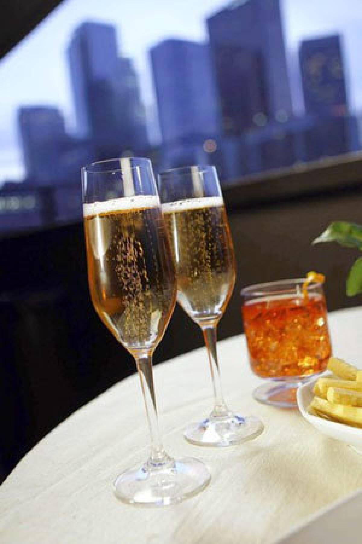 Day-closing aperitifs can include a kir royale, left, Negroni or Campari and soda.