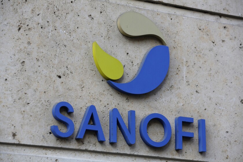Sanofi's logo appears on a wall of its headquarters building.