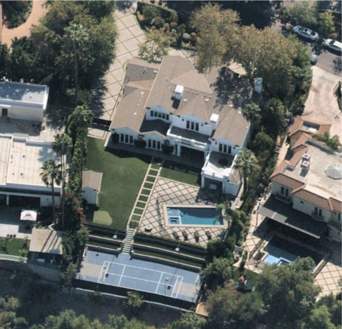 An aerial of the home, which includes a movie theater, wine cellar, gym, billiards room, swimming pool and basketball court.