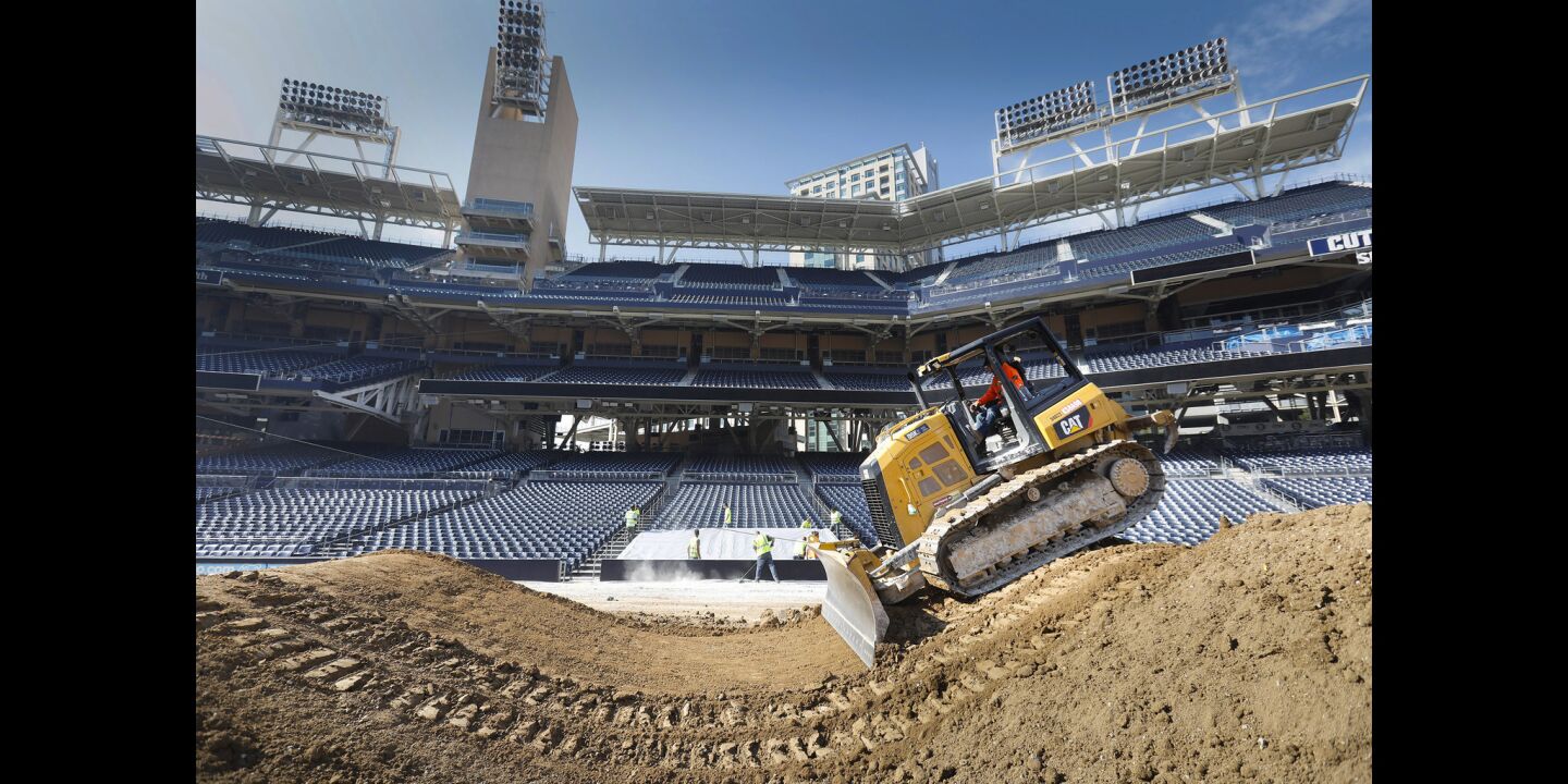 Billy Swapp operates a bulldozer to create jumps on the racetrack being created out of 26 million pounds of dirt on the baseball field at Petco Park, in preparation for the Monster Energy Supercross, to be held Saturday, February 2. Padres fans need not worry about the field. After the supercross is over, a new field will be installed, and ready for the 2019 season.
