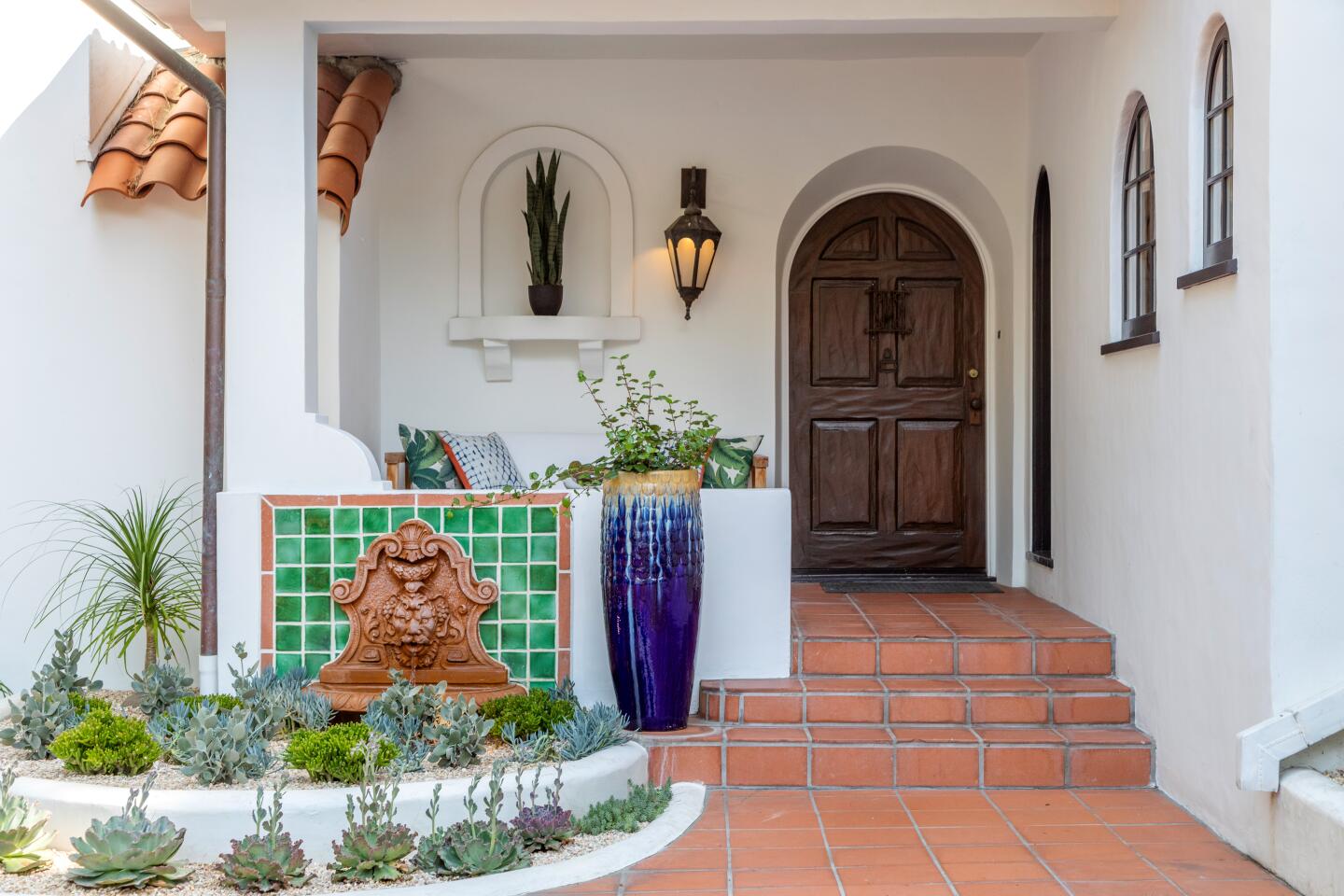 Colorful tilework creates visual interest around the entry.