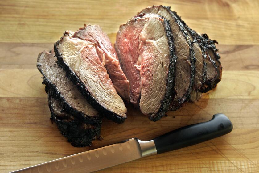 SEARED: A grilled leg of lamb gets an infusion of ethnic finesse with a marinade of yogurt and Indian spices.