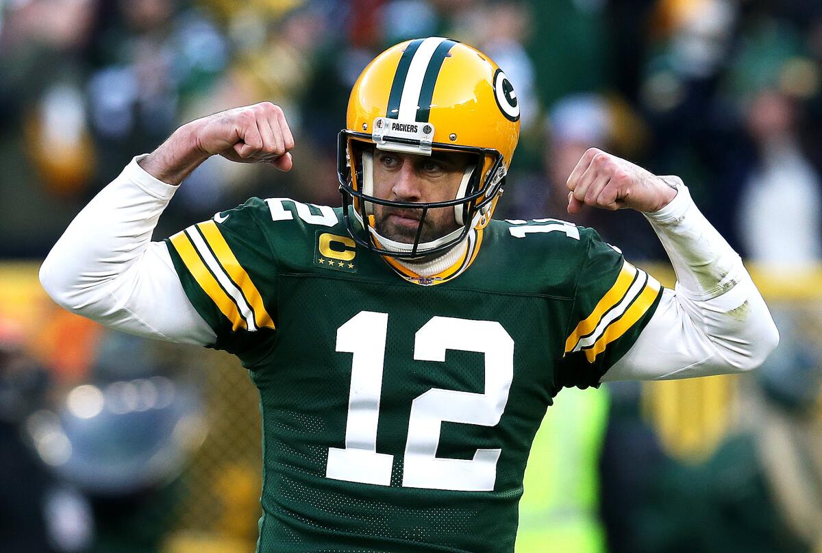 Packers quarterback Aaron Rodgers flexes after a touchdown against the Bears on Dec. 15 at Lambeau Field.