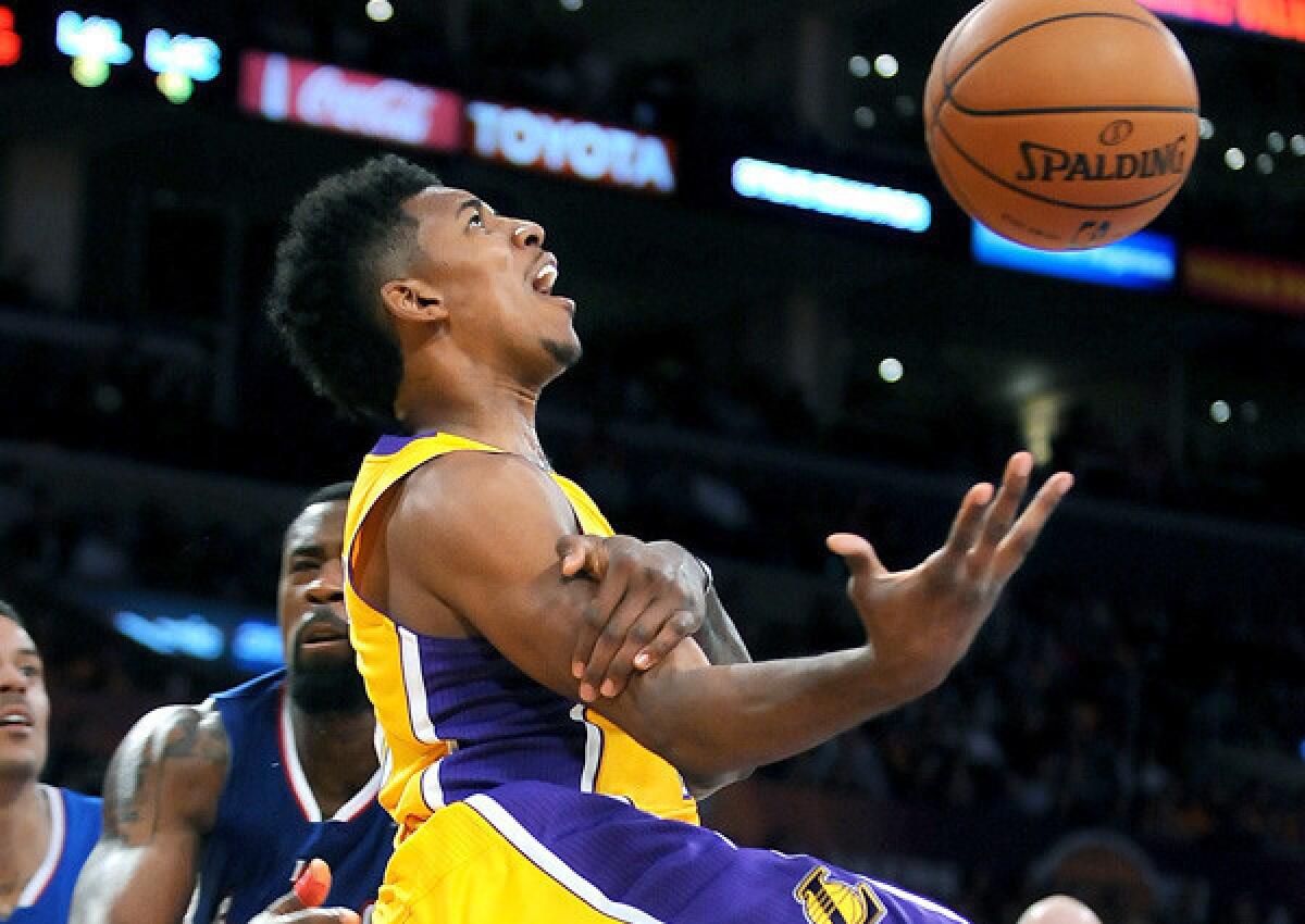 Lakers guard Nick Young is fouled by Clippers center DeAndre Jordan during a game earlier this season.