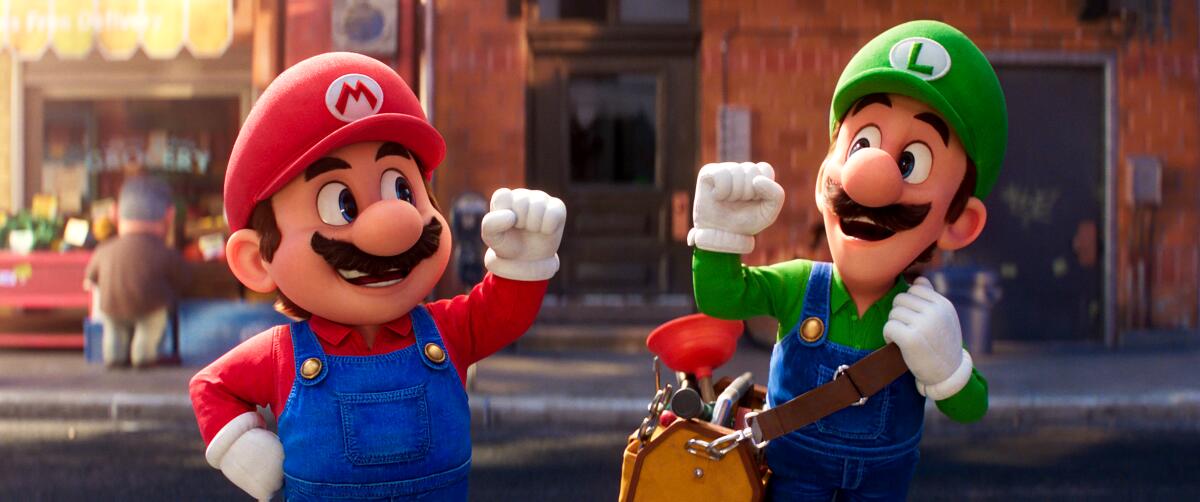 Mario and Luigi smile at each other and pump their fists.
