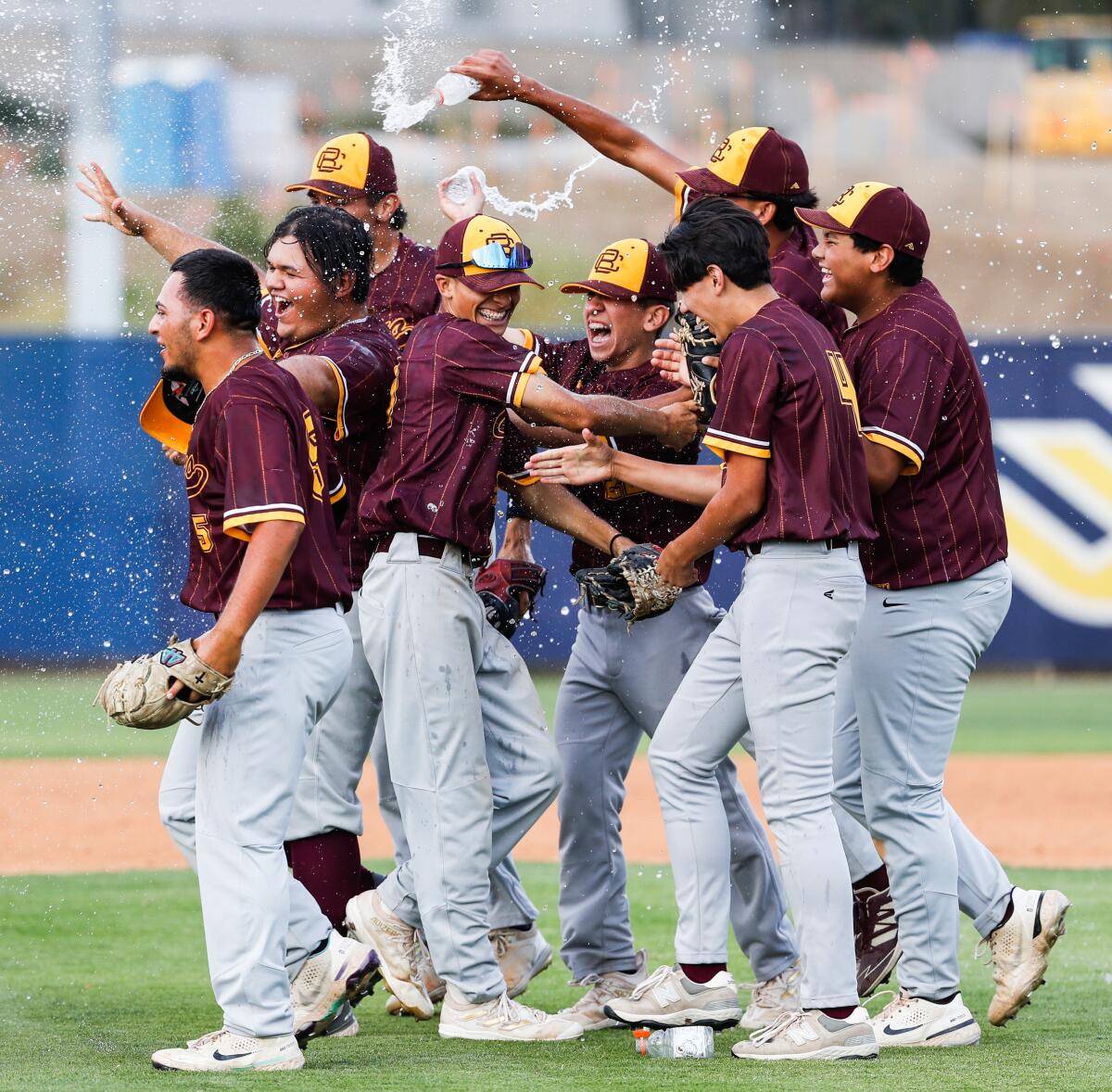 Calexico players celebrate after beating Bishop's in Division IV baseball final Saturday at UC San Diego's Triton Ballpark.
