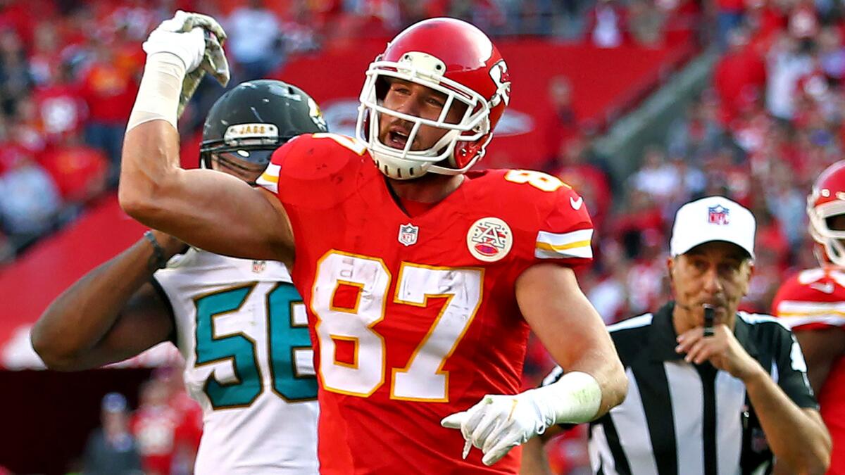 Chiefs tight end Travis Kelce (87) throws a towel toward field judge Mike Weatherford (not pictured) in protest for not getting a penalty call.