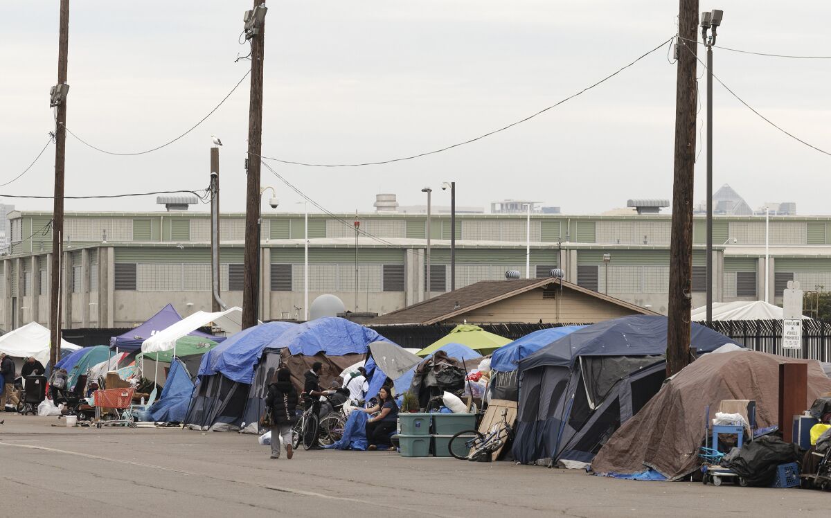 A photo from Jan. 31 shows a row of tents at a homeless encampment on Sports Arena Boulevard. 