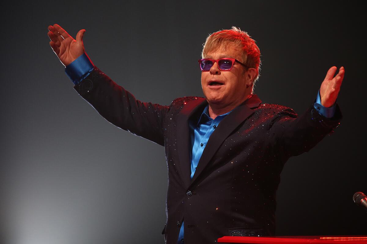 Veteran rock star Elton John, shown during a Los Angeles performance in January, is asking fans to create videos for three of the biggest hits he wrote with longtime songwriting partner Bernie Taupin.