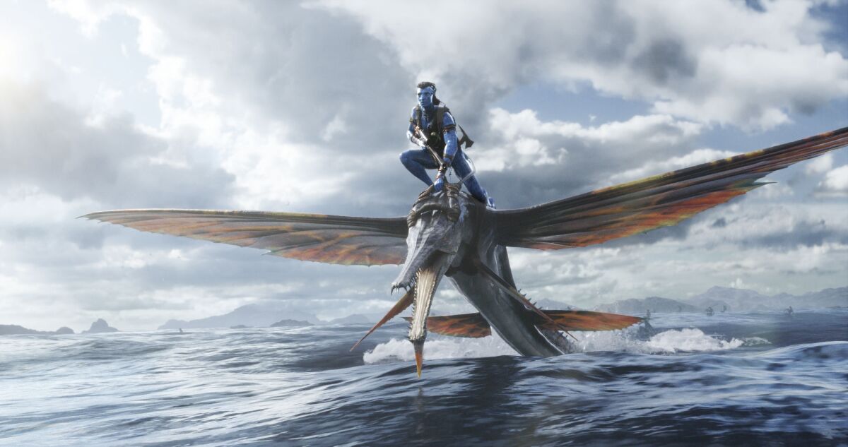 A CGI image of a blue man riding on the back of a winged creature over a body of water