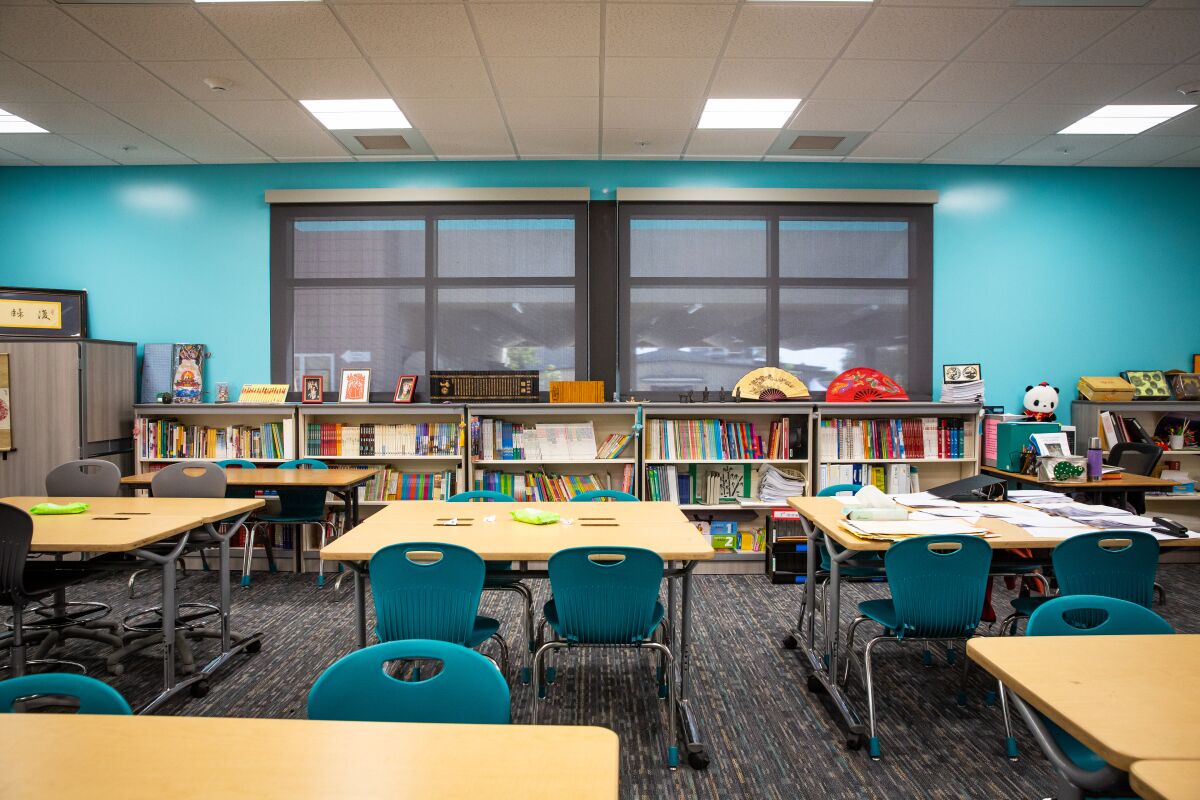 The new classrooms at Pacific Beach Middle School provide enough space for Mandarin teacher Yan Yan's extensive library.