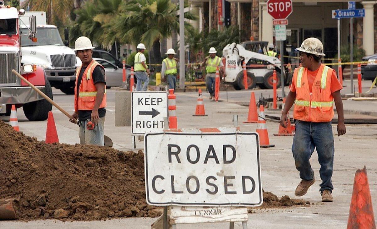Workers replace aging sewer and water lines in downtown La Jolla several years ago