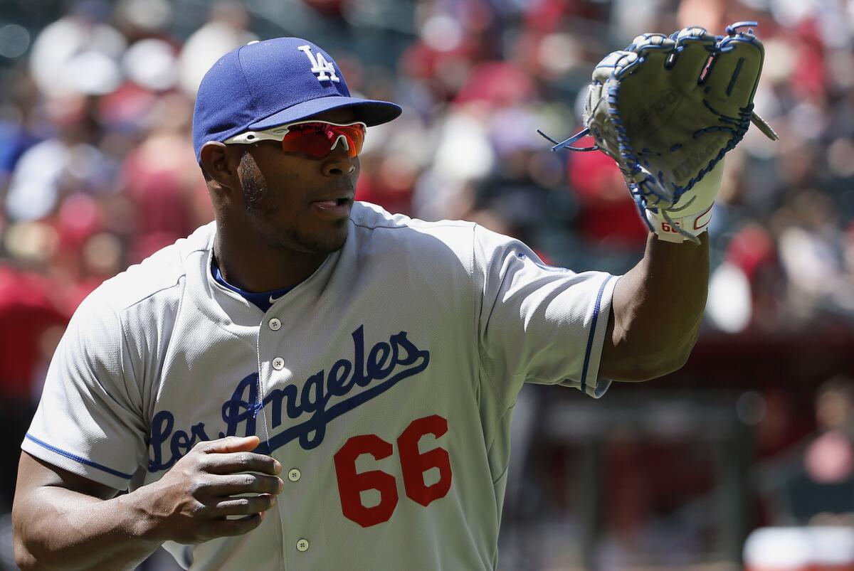 Dodgers outfielder Yasiel Puig waits for a throw as he warms up prior to a game against the Arizona Diamondbacks on April 12.