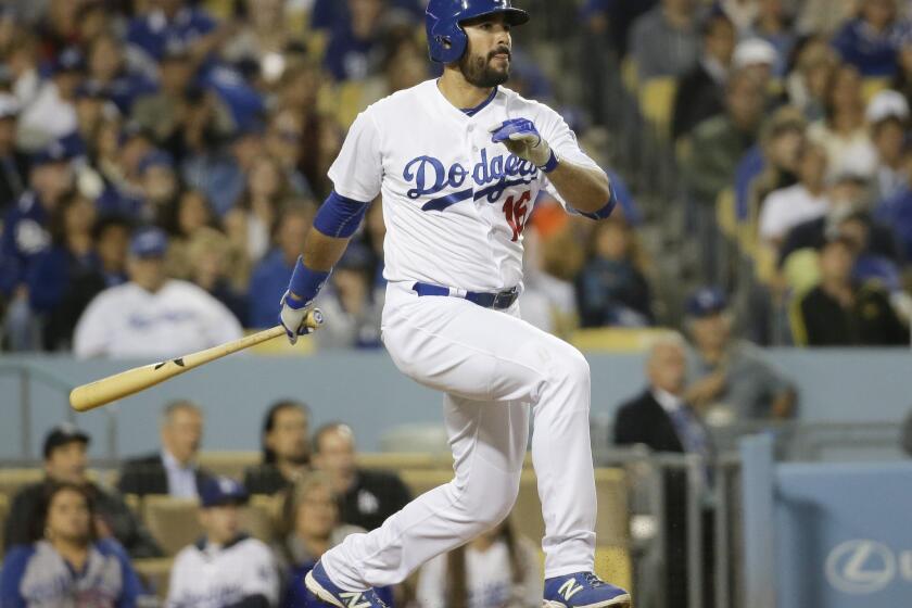 Dodgers outfielder Andre Ethier lines a single against the Marlins during the fifth inning.