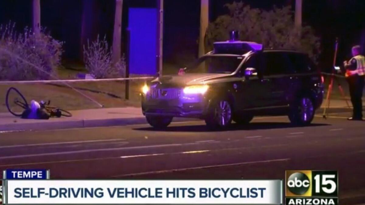 Police investigate a fatal accident involving a self-driving Uber car on March 19 in Tempe, Ariz.