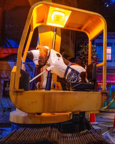 Robotic dogs and cats play with construction equipment on 'The Secret Life of Pets' ride. 