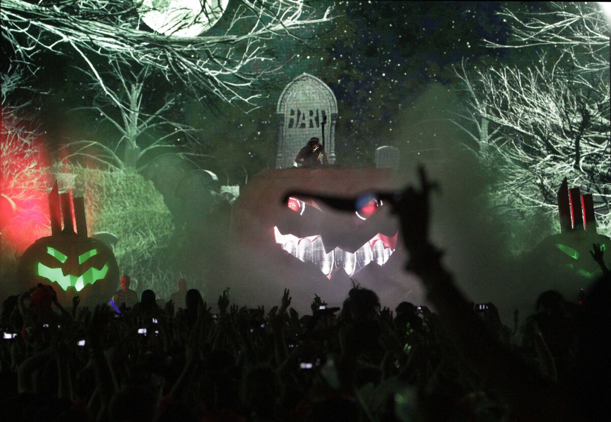 Skrillex on top of the Halloween pumpkin at the Hard Day of the Dead electronic dance music festival at Los Angeles State Historic Park in 2013.