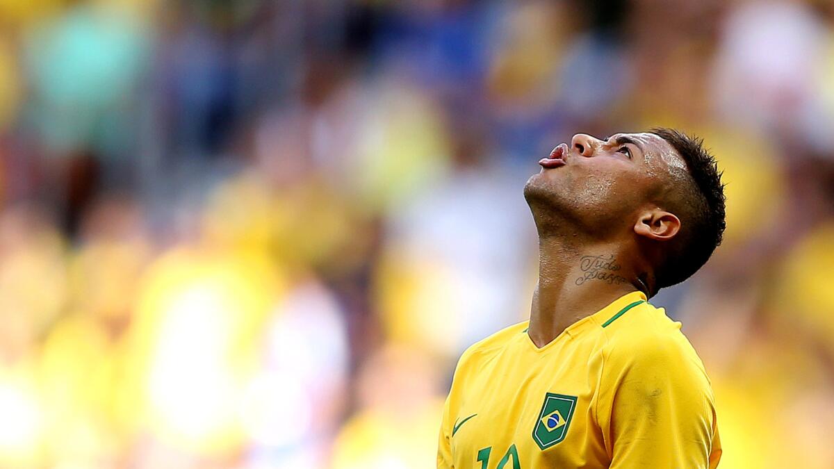 Brazil striker Neymar reacts to a missed opportunity against South Africa on Thursday.