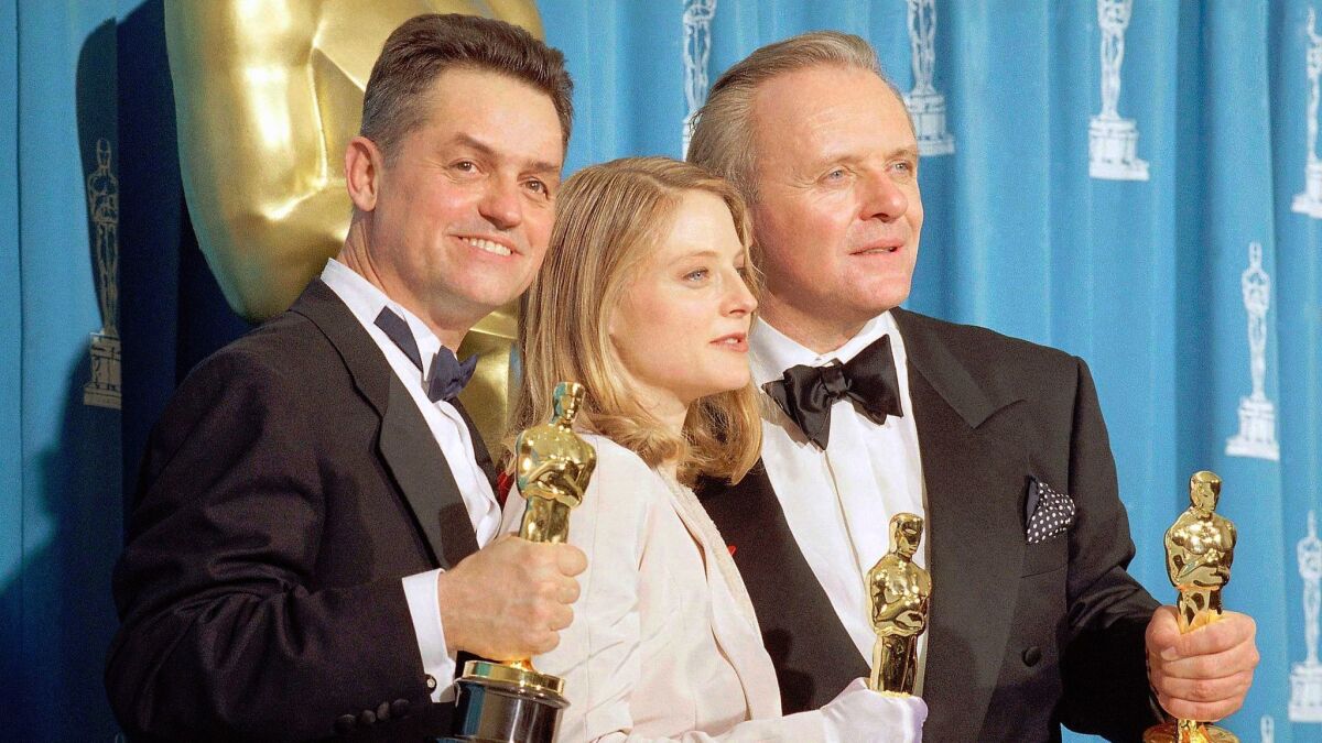 irector Jonathan Demme, from left, actress Jodie Foster and actor Anthony Hopkins hold their Oscars for their work on "Silence of the Lambs," at the Academy Awards in Los Angeles on May 31, 1992.