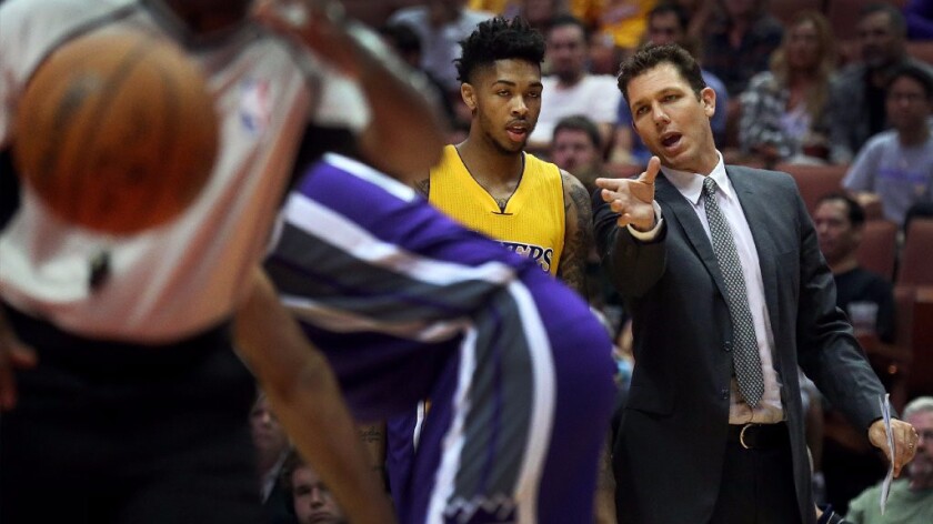 Lakers Coach Luke Walton talks with rookie Brandon Ingram during a game against the Kings on Oct. 4.
