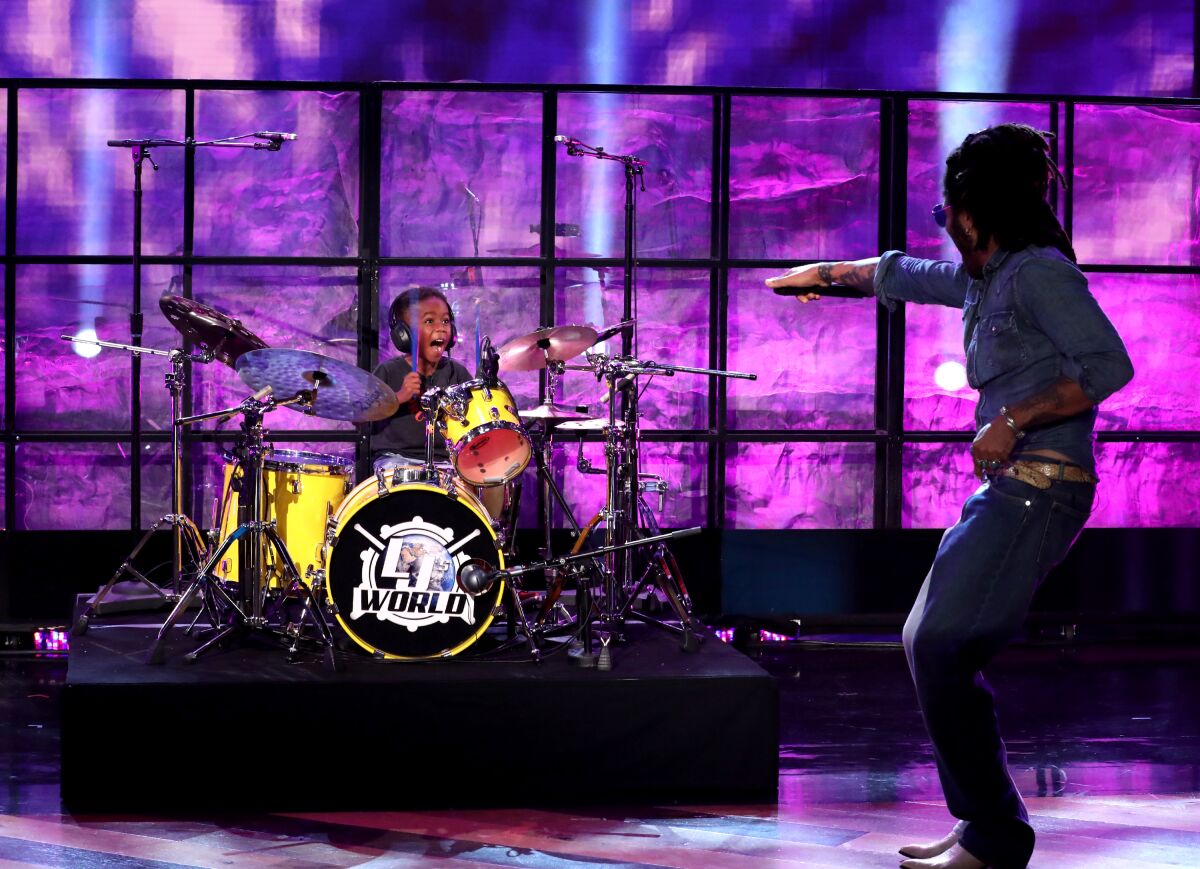 5-year-old Justin Wilson II, at a set of drums, reacts to meeting Lenny Kravitz on "The Ellen DeGeneres Show."