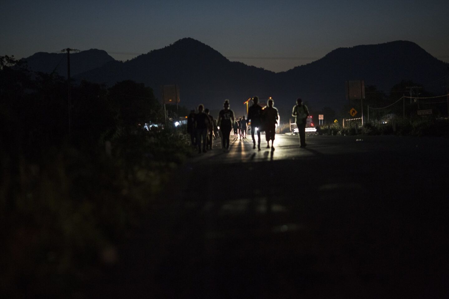Central American migrants traveling with a caravan to the U.S. make their way to Pijijiapan, Mexico.