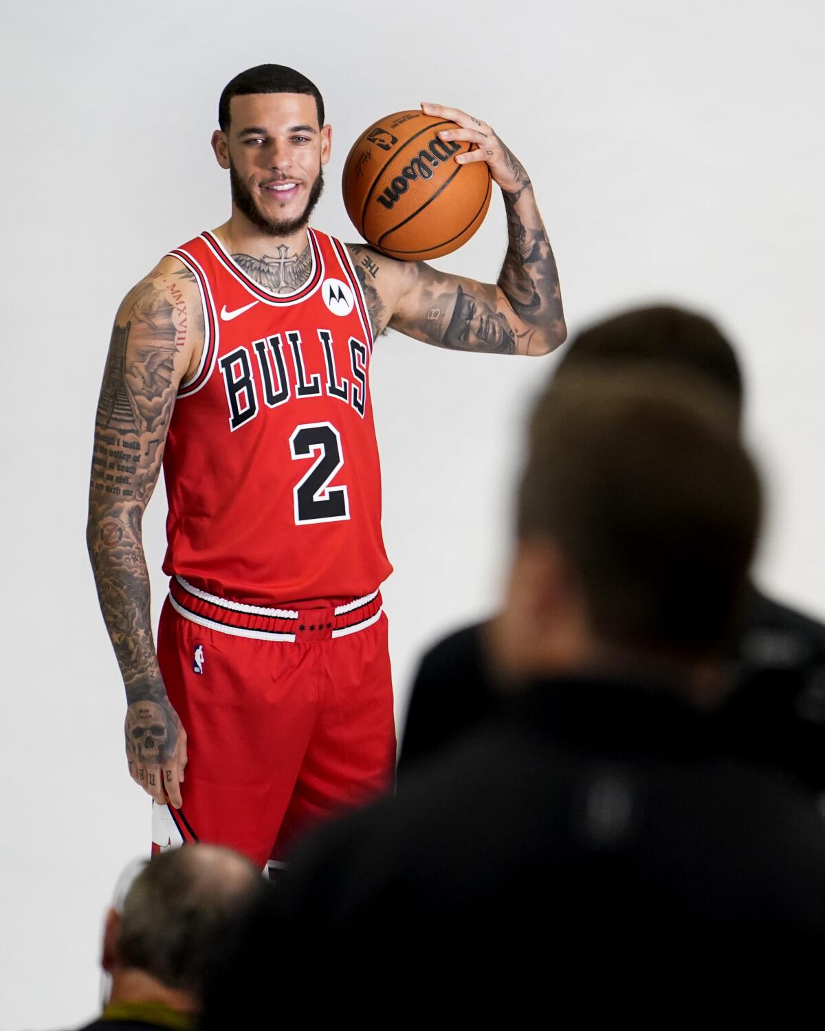 Chicago Bulls guard Lonzo Ball poses with the ball over his left shoulder.