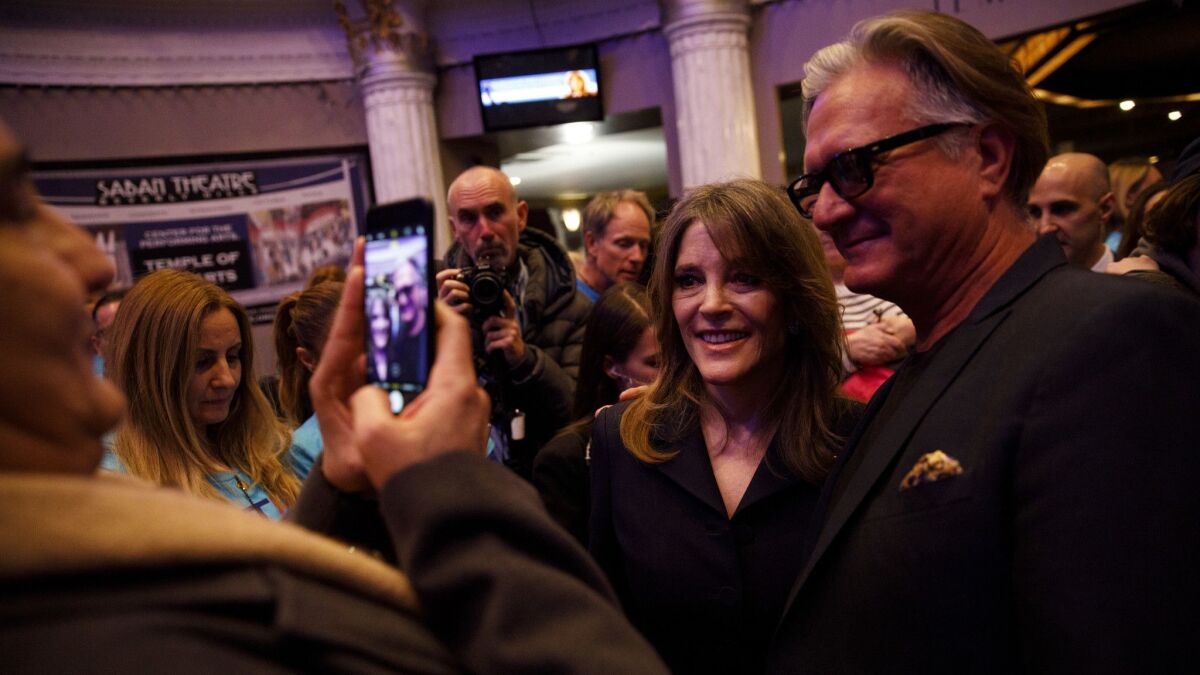 Marianne Williamson is greeted by supporters at the Saban Theatre.