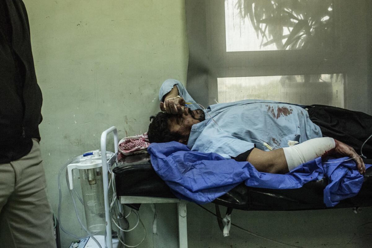 A man wounded Thursday in a car bomb attack in Mosul, Iraq, waits for treatment at a hospital in Irbil.