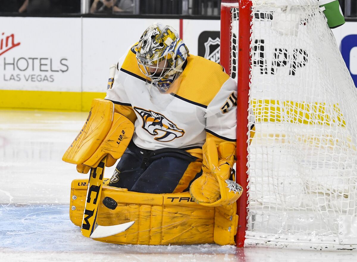 Nashville Predators goalie Juuse Saros makes a save against the Vegas Golden Knights during the second period of an NHL game Tuesday, Jan. 4, 2022, in Las Vegas. (AP Photo/Sam Morris)