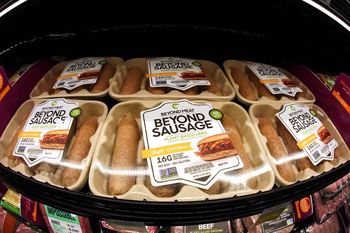 FILE - Beyond Meat brand Beyond Sausage are displayed in a cooler in a market in Pittsburgh, Wednesday, May 5, 2021. Plant-based meat maker Beyond Meat reported lower-than-expected sales in the third quarter due to a slump in U.S. demand (AP Photo/Gene J. Puskar, File)